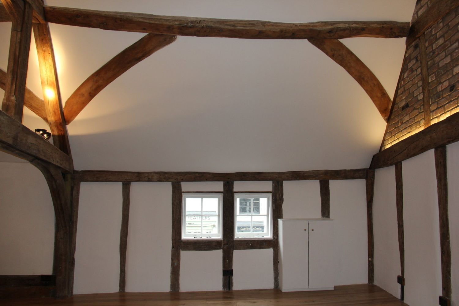 A finished listed interior, the timber frame left exposed
