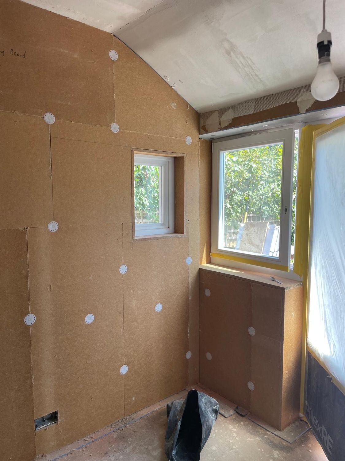 Insulation boards fixed to the inside of the walls