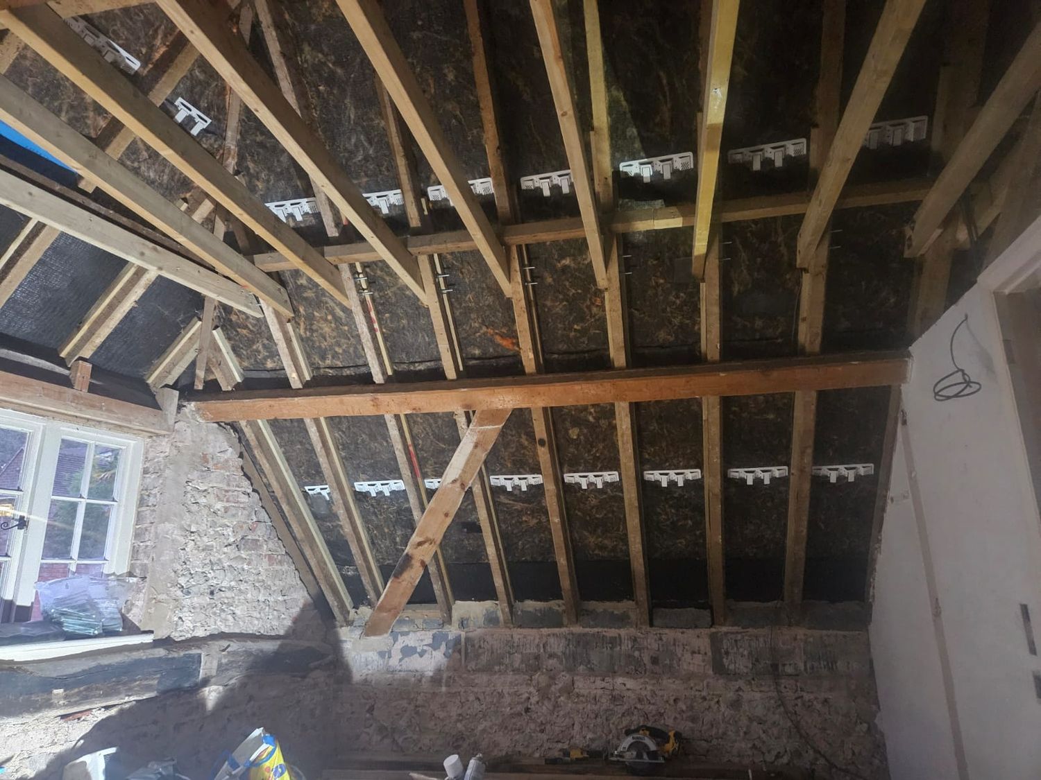 Preparation for roof insulation, felt lap vents installed