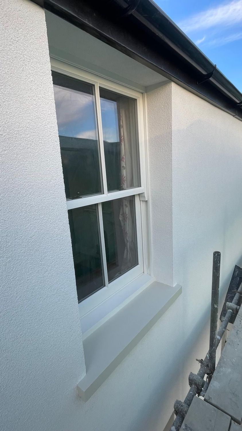 New window sills painted, gutters re-fitted