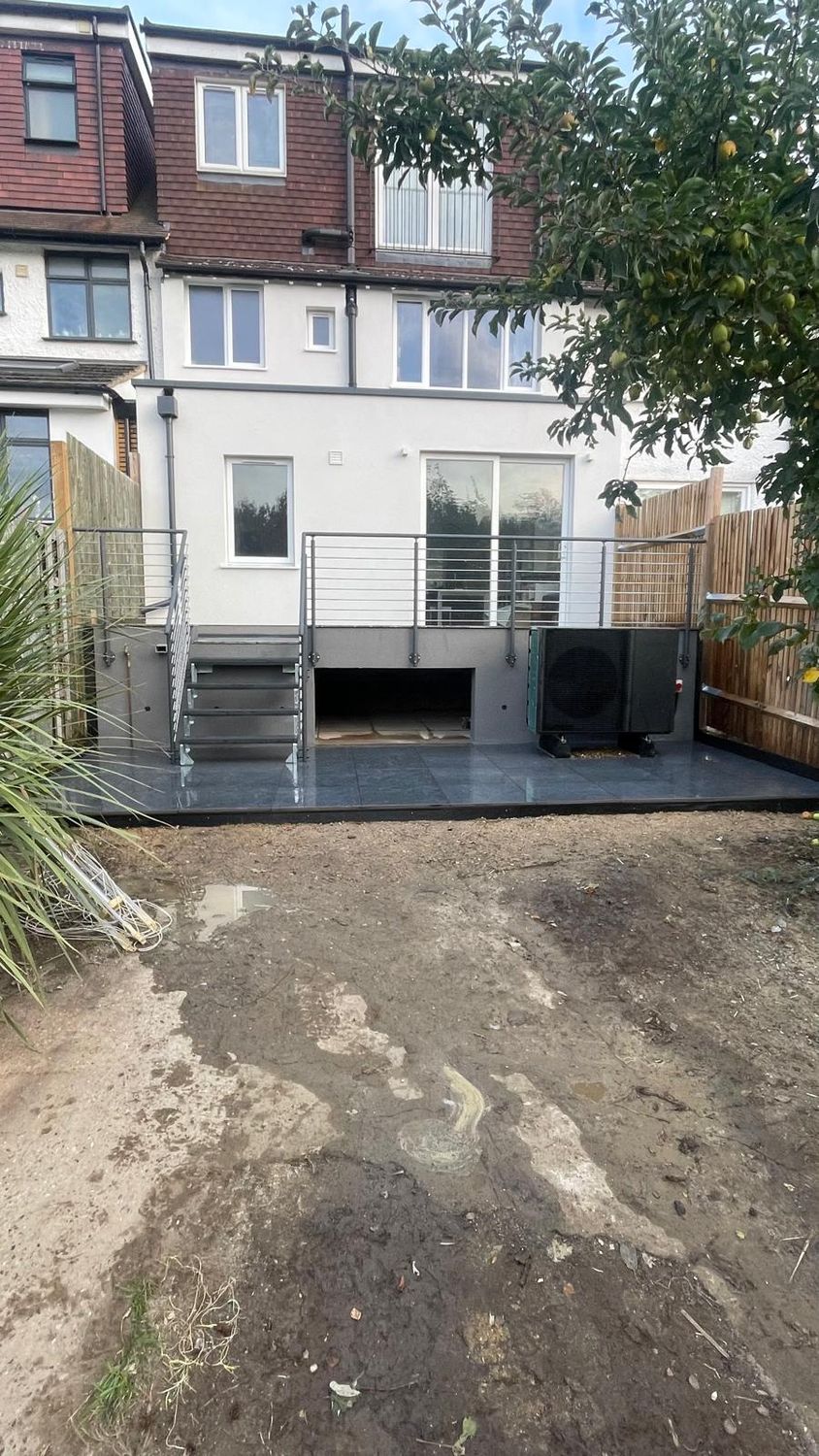 Timber-framed extension with blown cellulose and renovation with heat pump integration