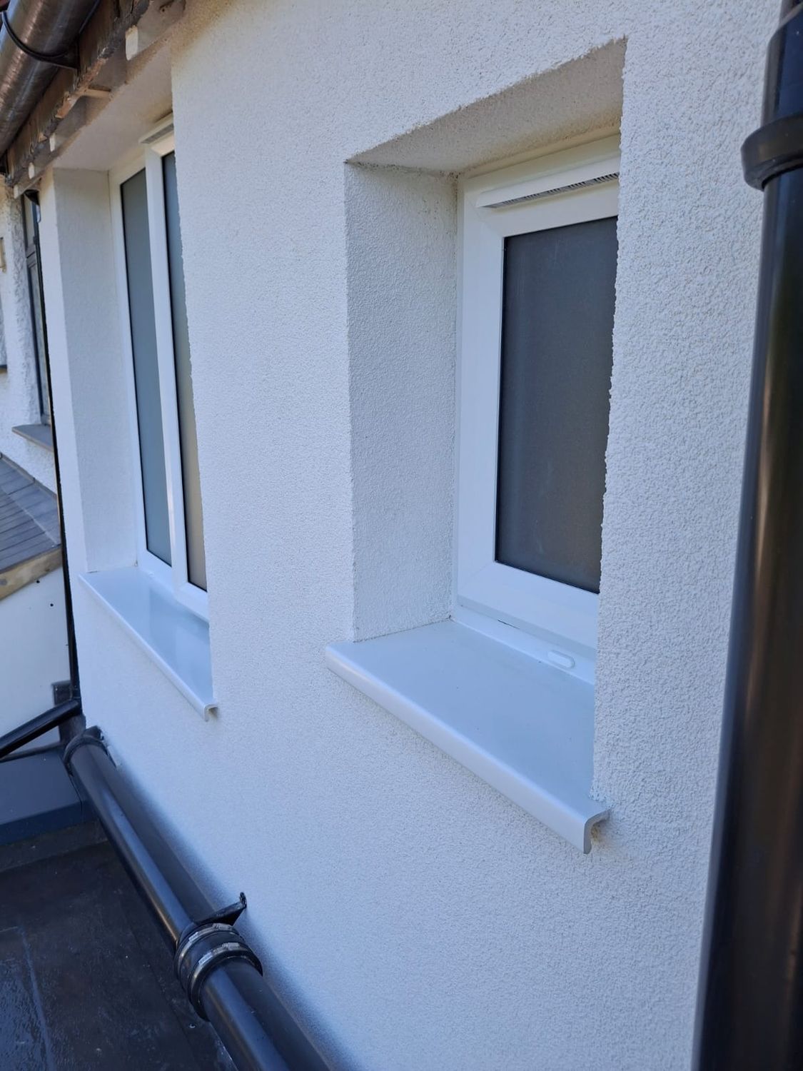 External wall insulation with UPVC window sill