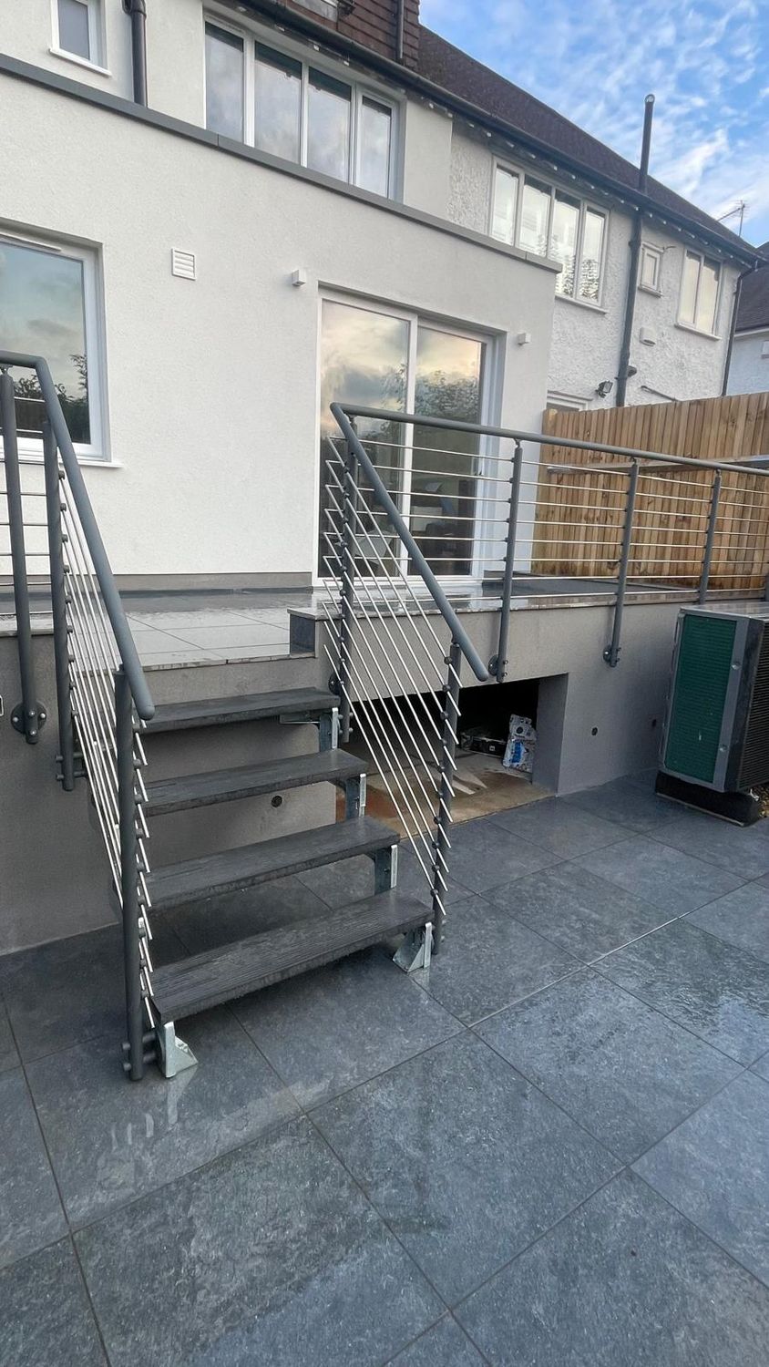 External patio, paving and banister installed