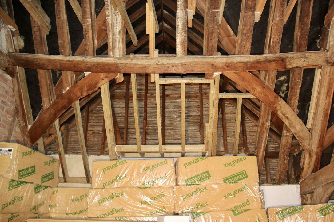 Before installation of flexible wood fibre insulation between rafters