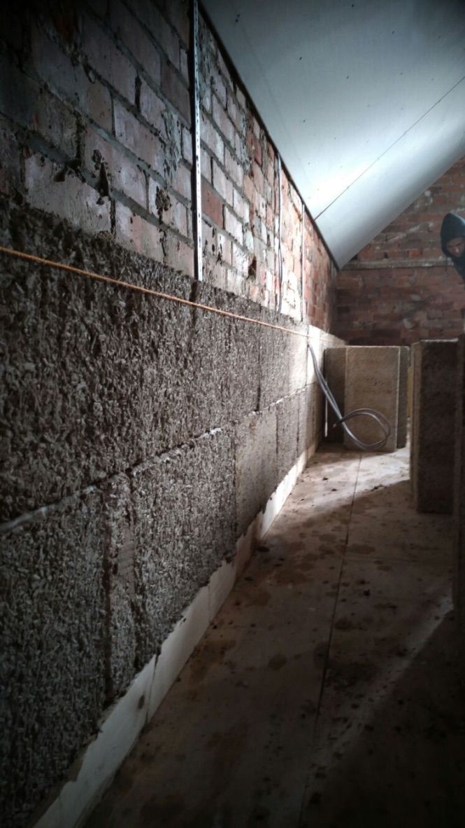 Loft room, installation of hempcrete insulation, with hemp blocks