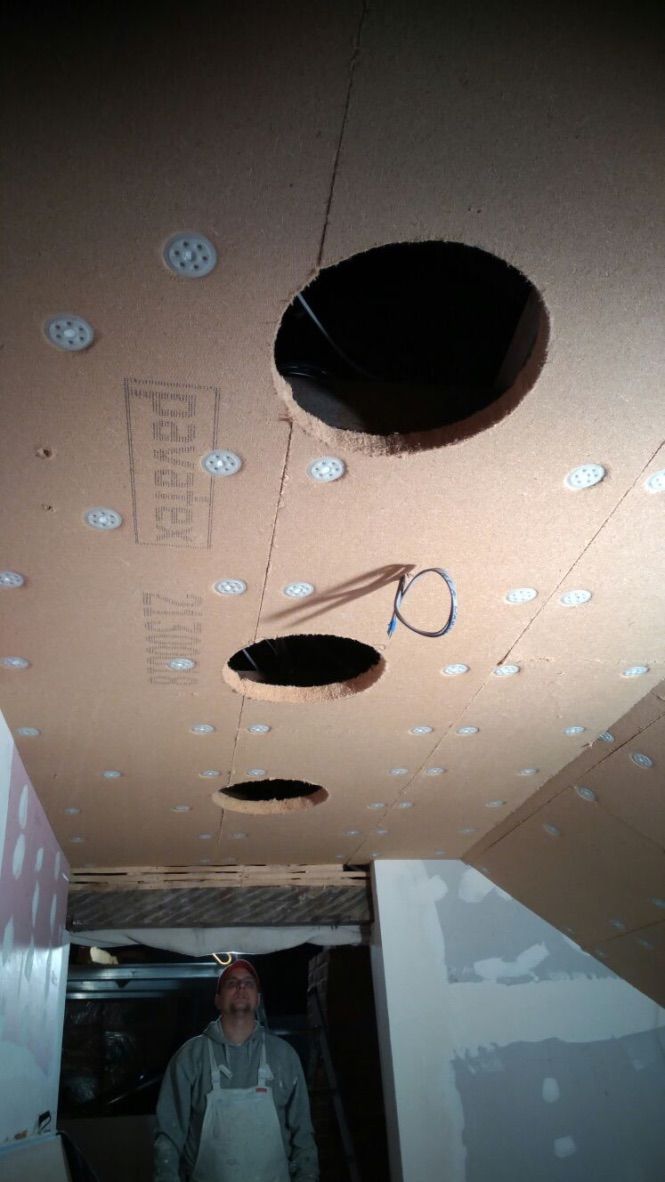 Installation of kitchen ceiling wood fibre insulation with sun tunnels