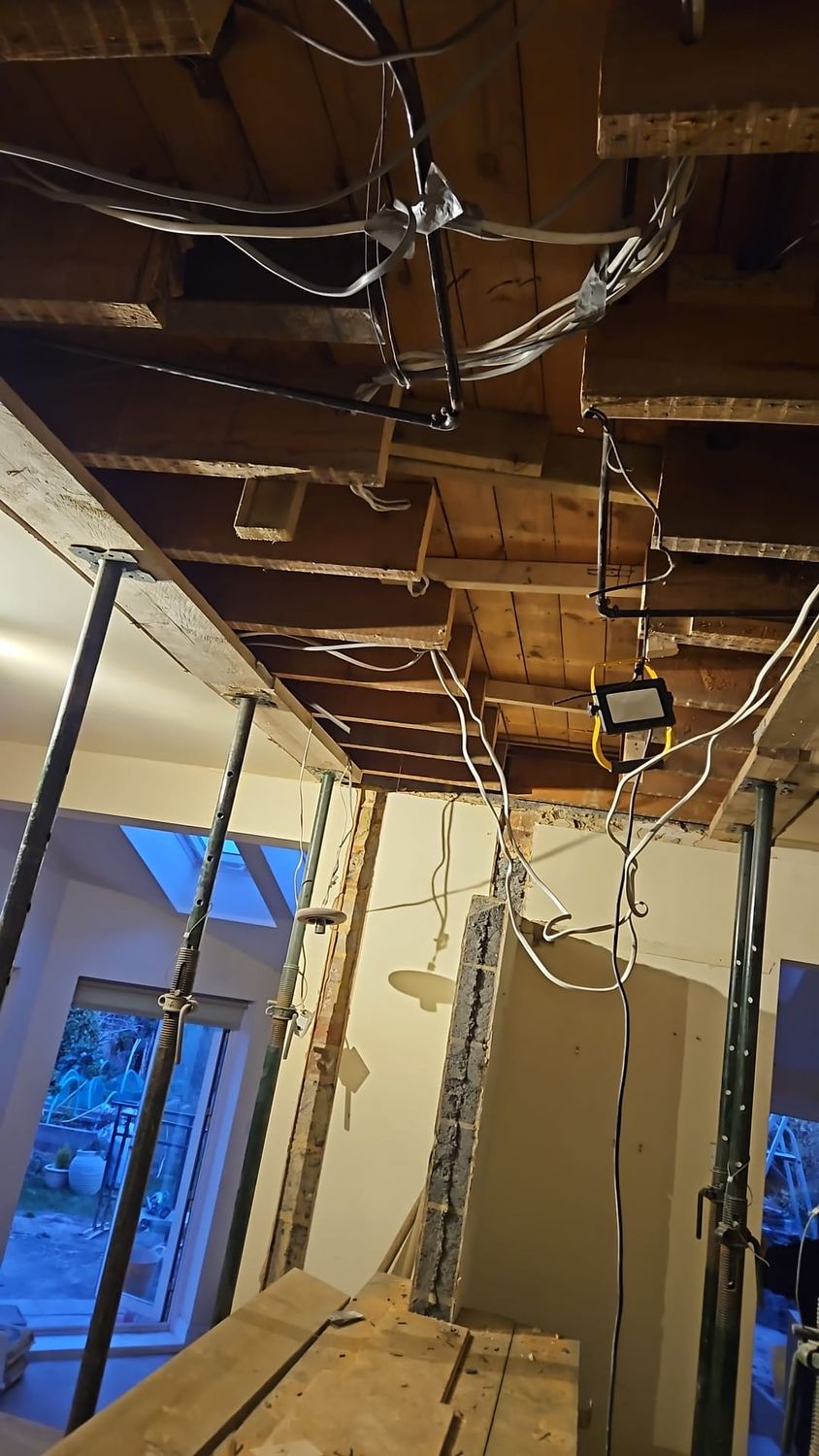 Temporary works, joists cut out for structural steel inserted into ceiling structure