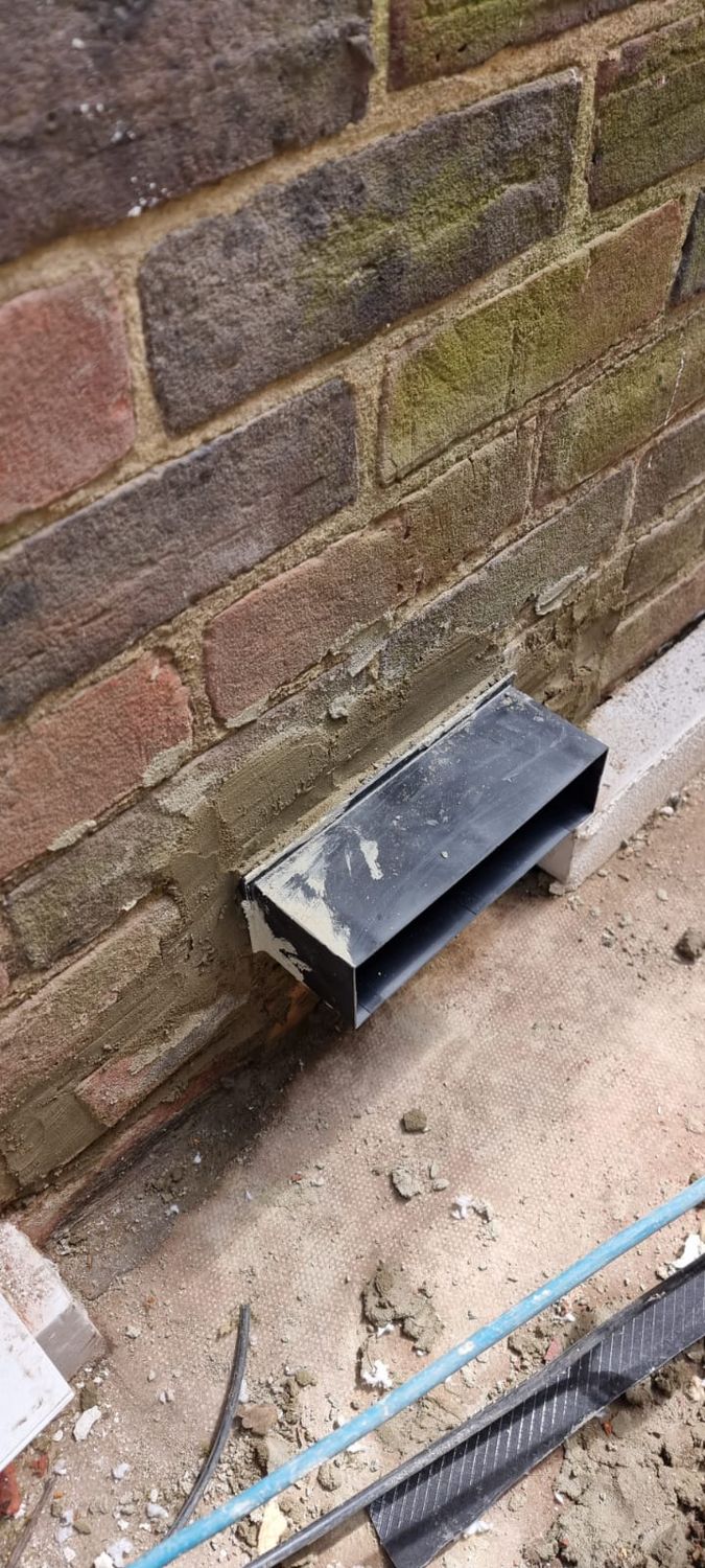 Telescopic subfloor ventilation installed before external wall insulation and suspended floor insulation