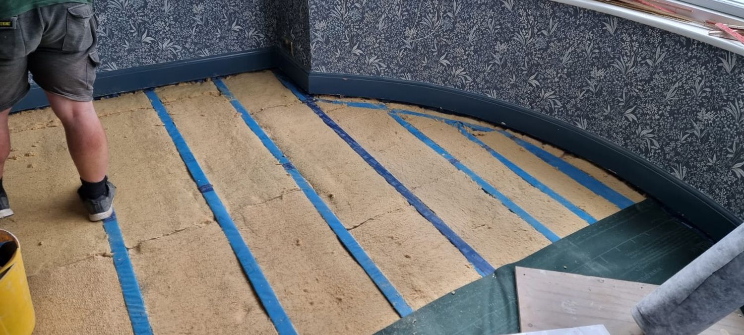 Suspended floor insulation with Pro Clima Solitex Plus, Gutex thermoflex wood fibre insulation and Pro Clima DA airtightness membrane