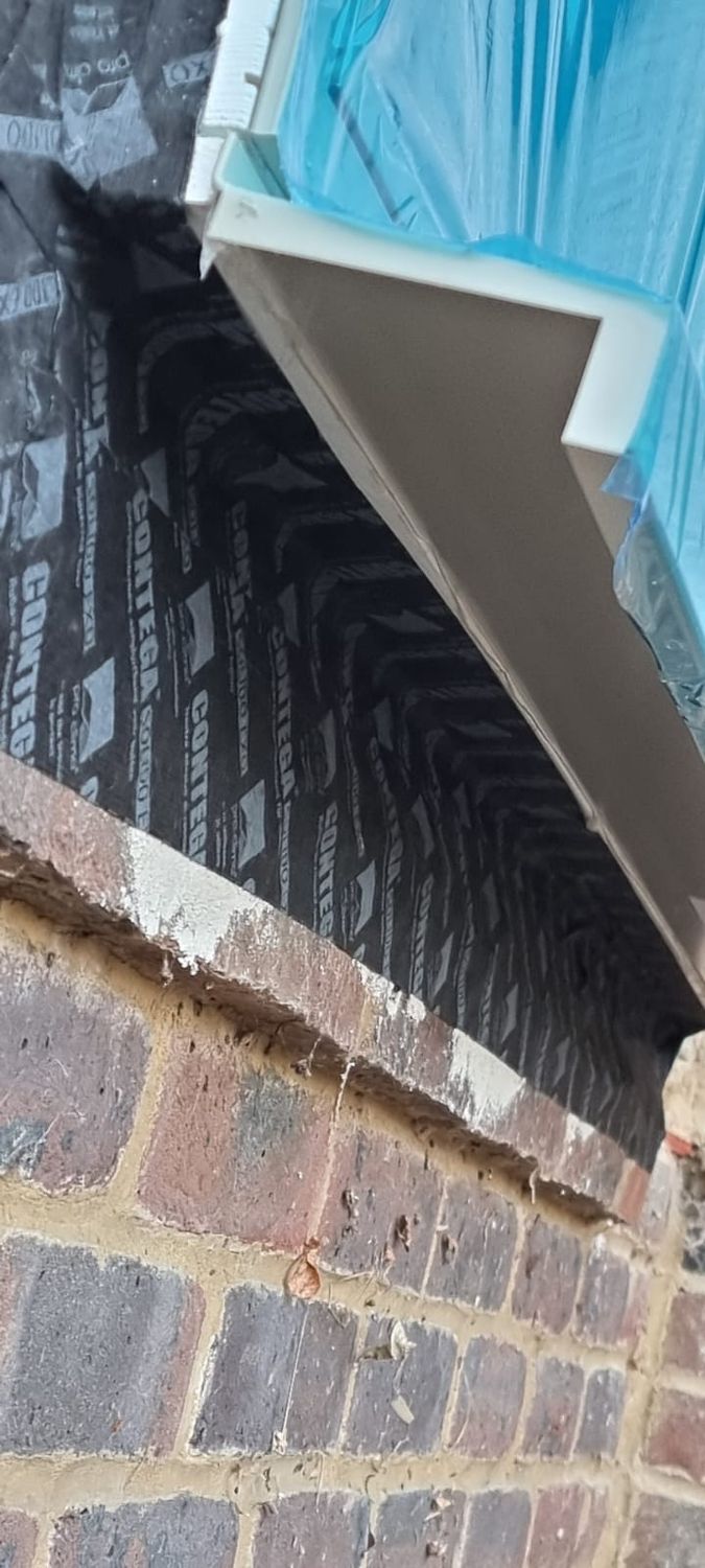 Preparation for External wall insulation works, airtightness detail contega solido exo tape used for making the window and fabric junction airtight before wood fibre insulation boards go on the walls