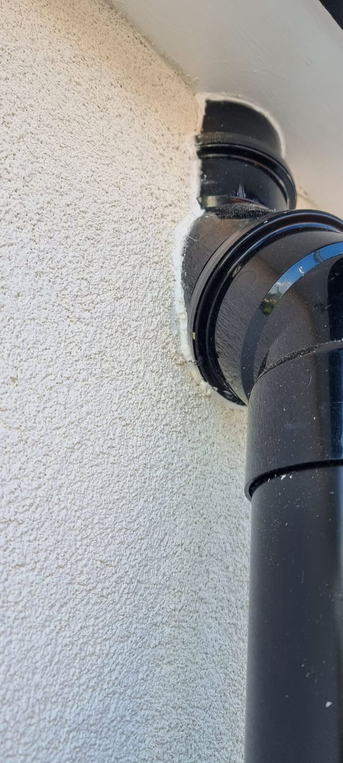 Detailing - external wall insulation with downpipes adjusted to new wall level