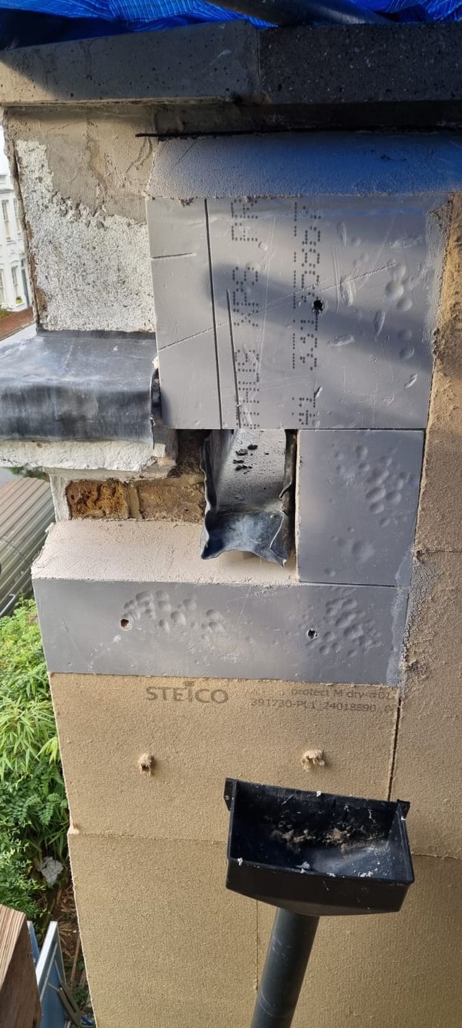 Insulation detailing around hopper and downpipe