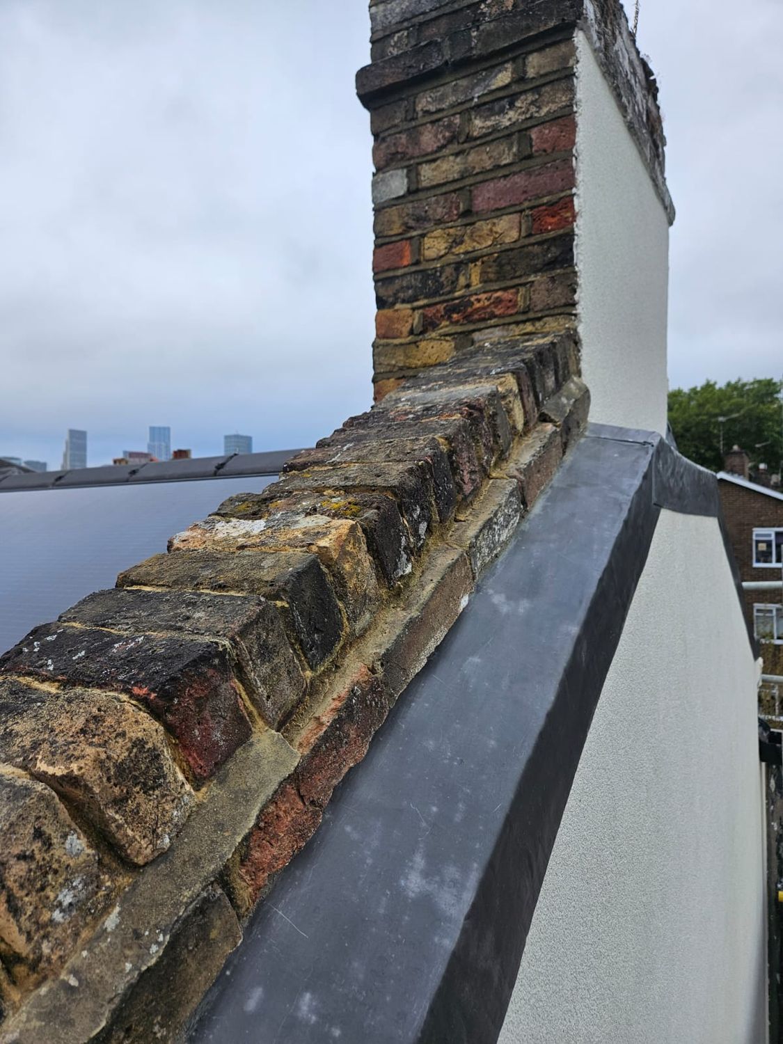 Wood fibre insulation boards chamfered & capped off with lead flashing