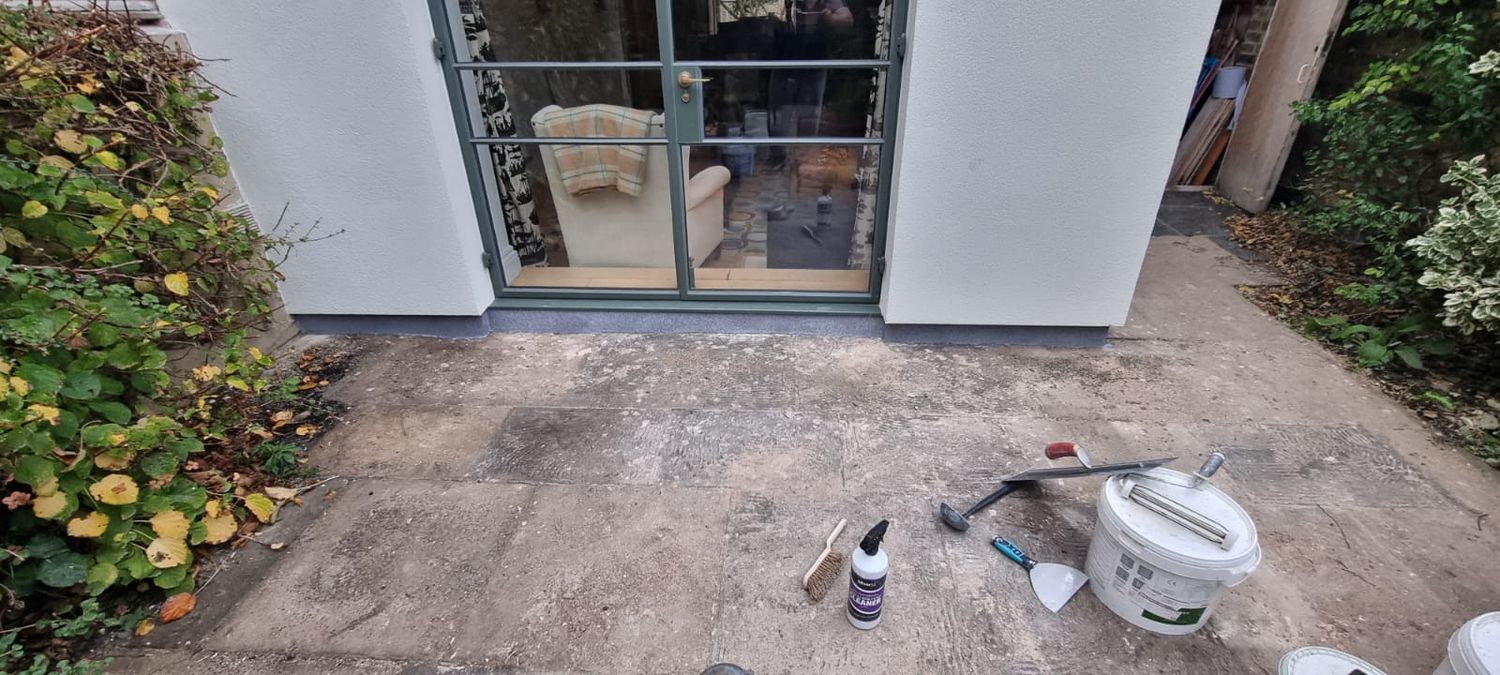 Plinth insulation finished with decorative grey mosaic render
