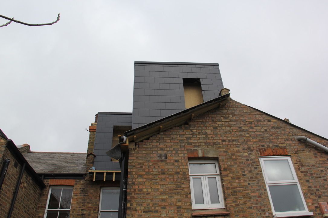 Completed loft conversion with external slate cladding