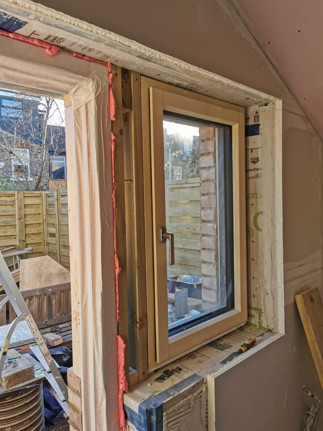 New window & door installation, airtight taping around reveals