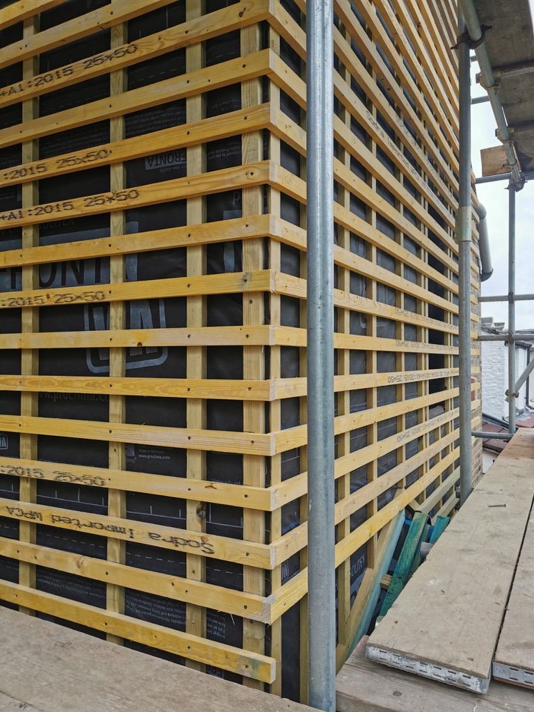 Battening installed for cladding over external wall insulation