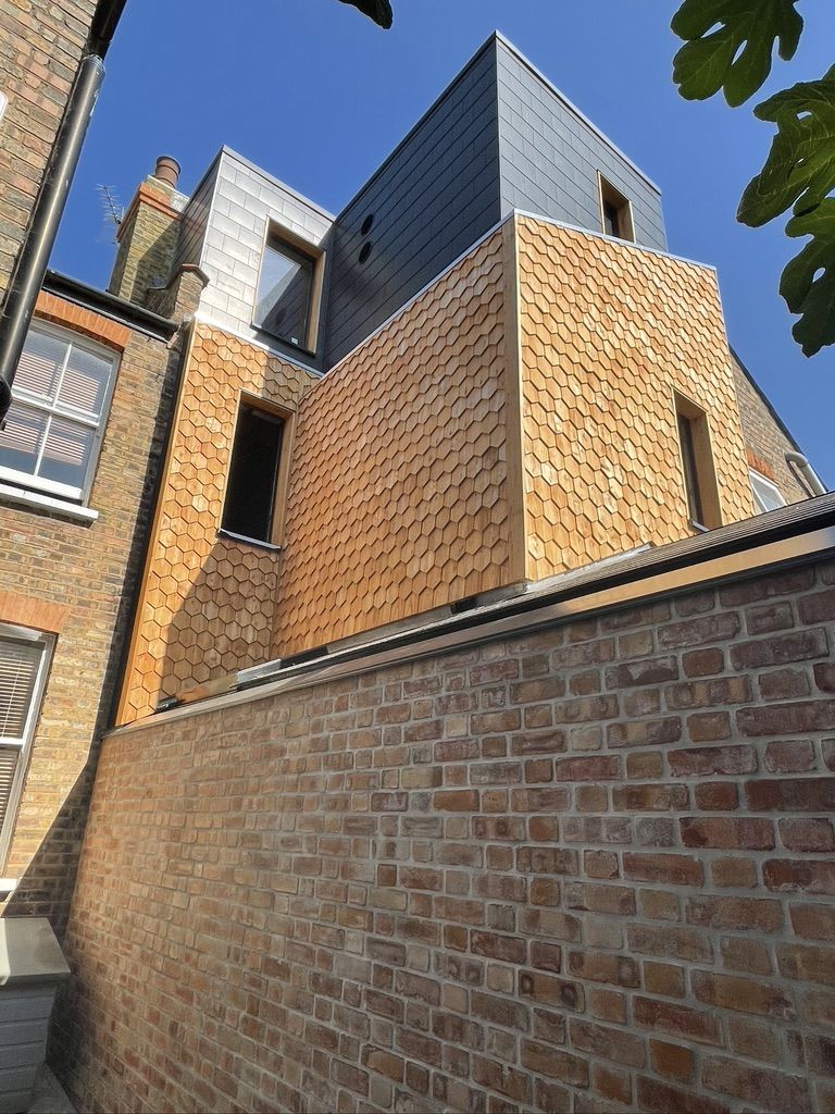 Completed insulation works cedar wood cladding, loft conversion and extension on a Victorian house