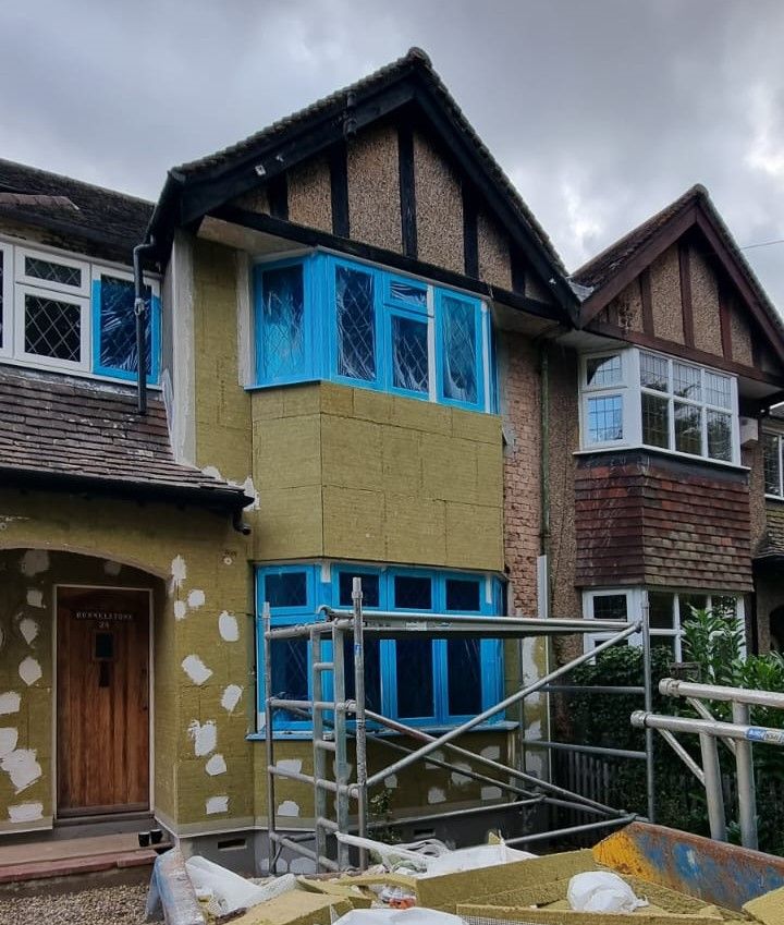 Rockwool boards being mechanically fixed to front wall