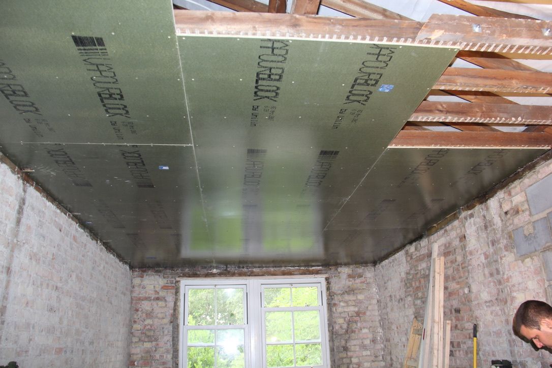 Finsa SuperPan Airtight vapour barrier racking boards installed onto ceiling rafters