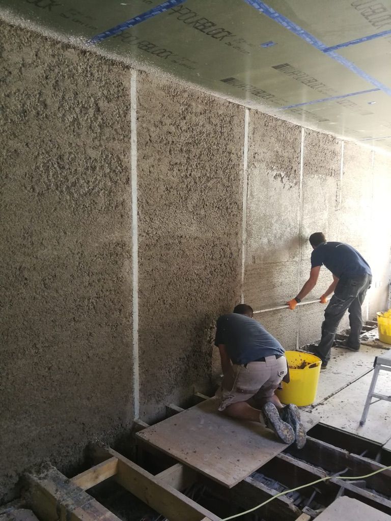 Diathonite Evolution lime cork insulation plaster being levelled off