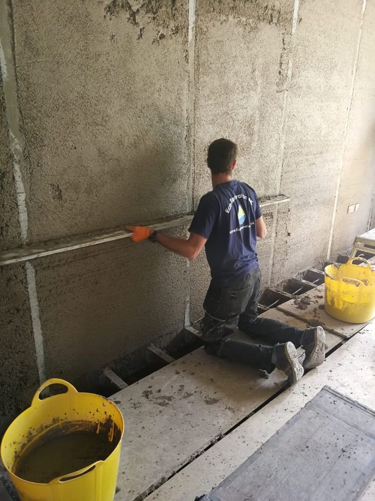 Diathonite Evolution lime-cork-clay insulation plaster being levelled off