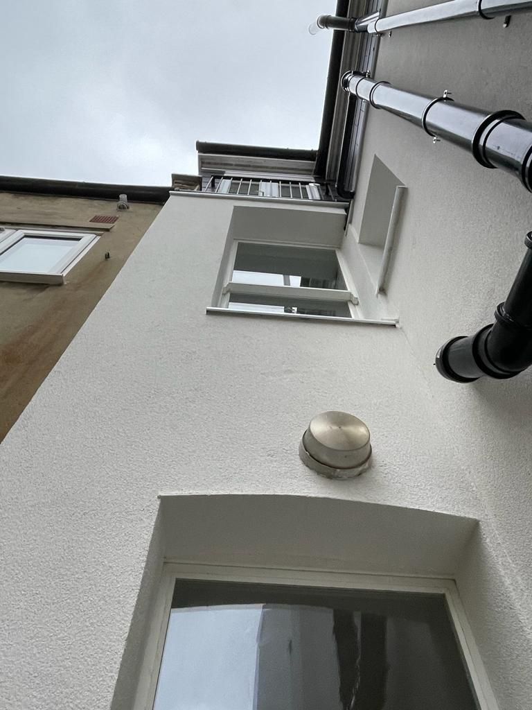 External wall insulation with cork insulation boards installed, aluminium window sills