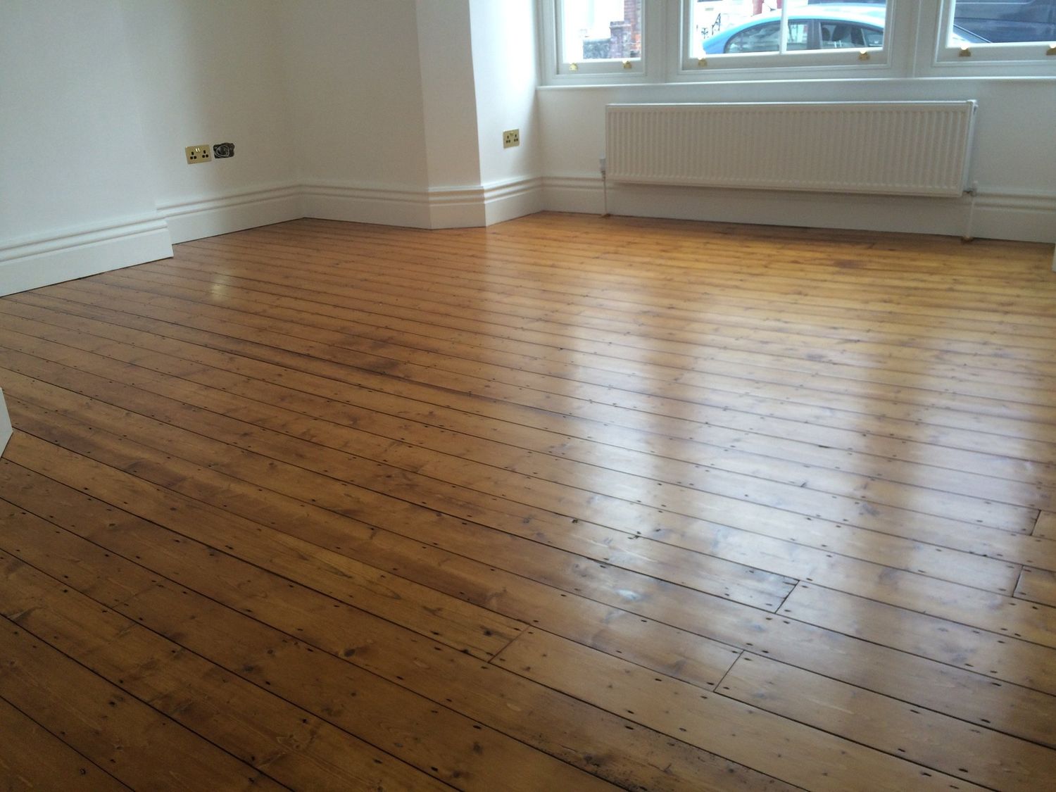 Reclaimed floor boards sanded and oiled in Edwardian property in Belsize Park