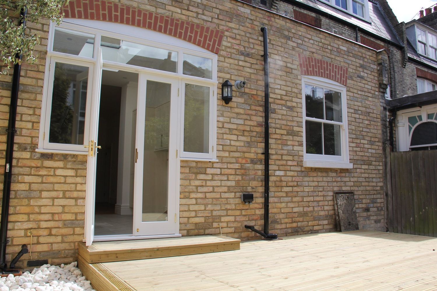 Rear extension and decking for an Edwardian house in Belsize Park