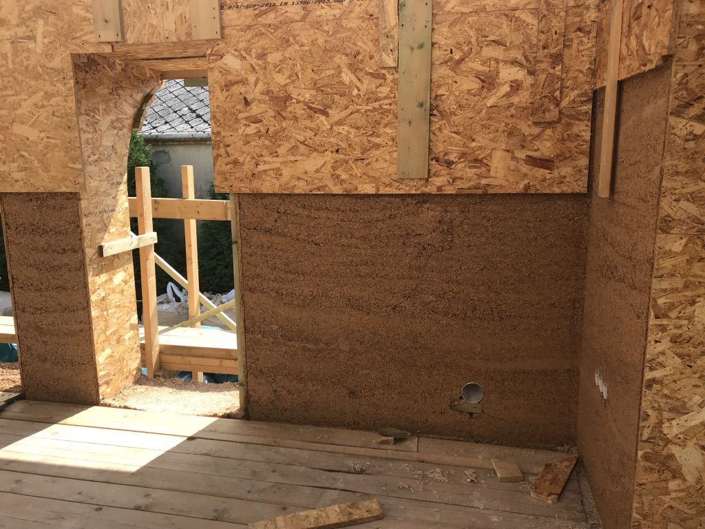 Moving shutters, hempcrete surface is shown