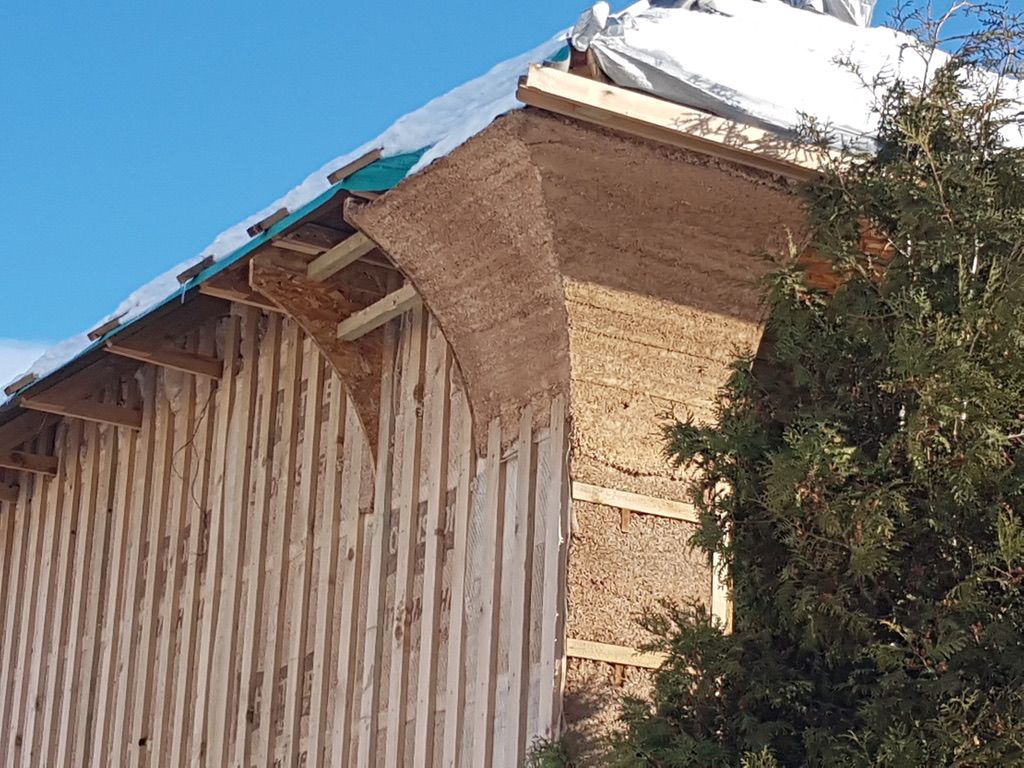 Hempcrete curved feature in corner, battening on the side