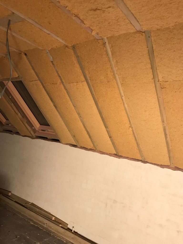 Install Pavatex Flexible wood fibre fitted between rafters