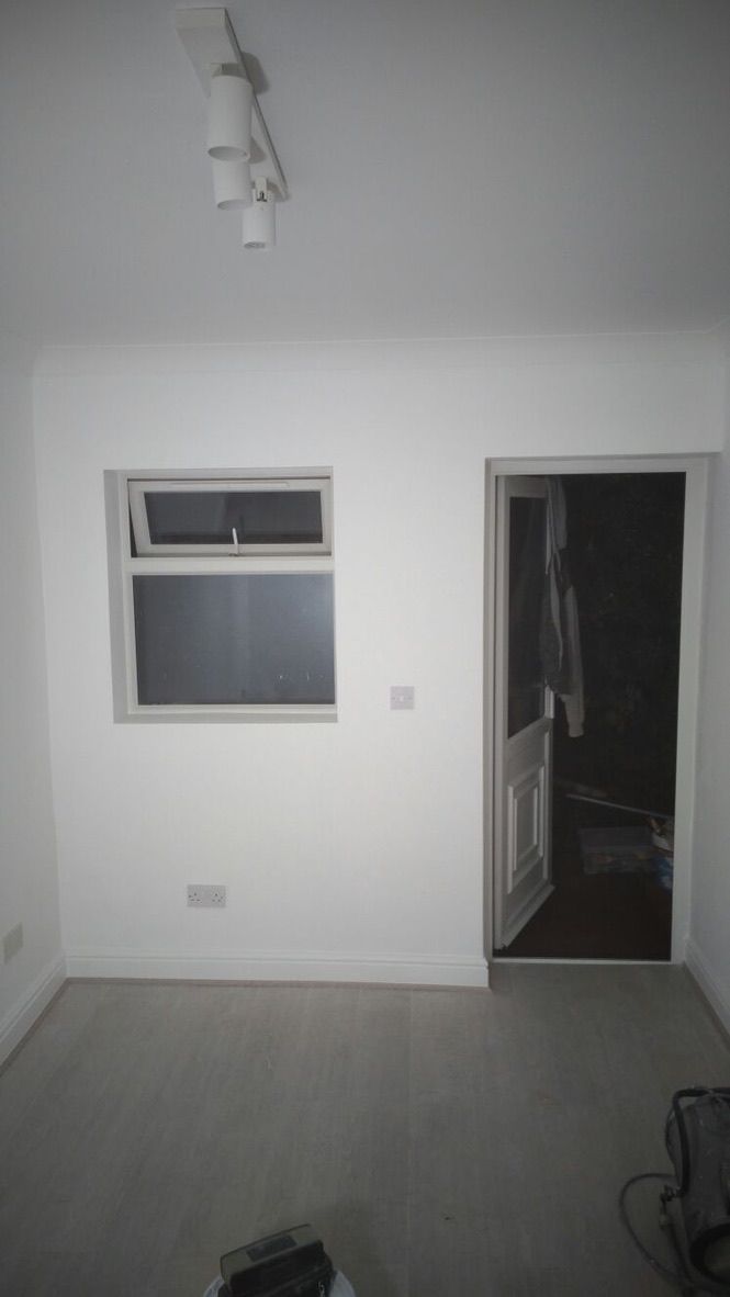 Insulated, lime plastered, painted walls in converted garage room