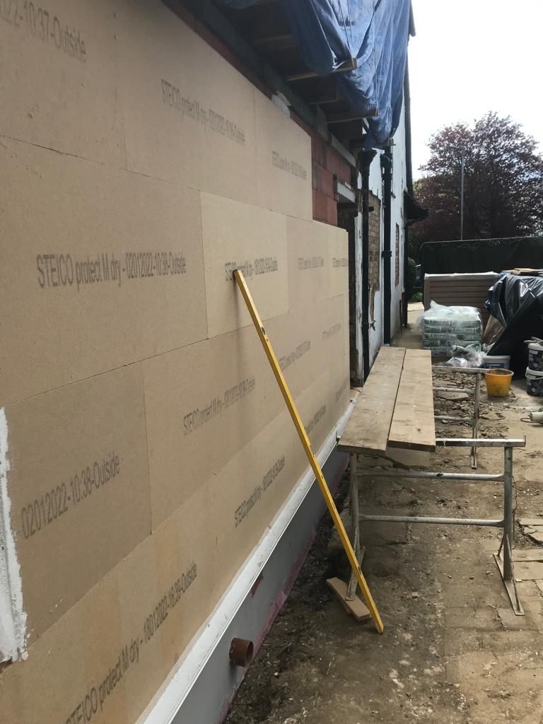 Steico wood fibre insulation boards being installed onto ceramic blocks