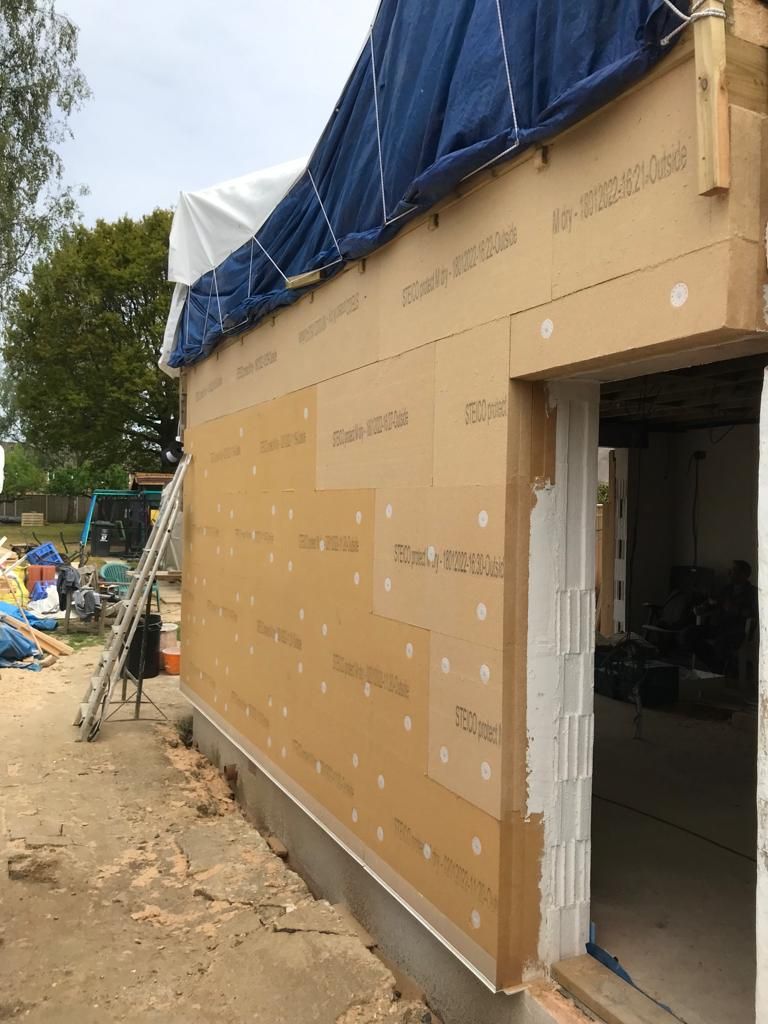 Steico wood fibre insulation boards being mechanically fixed to walls