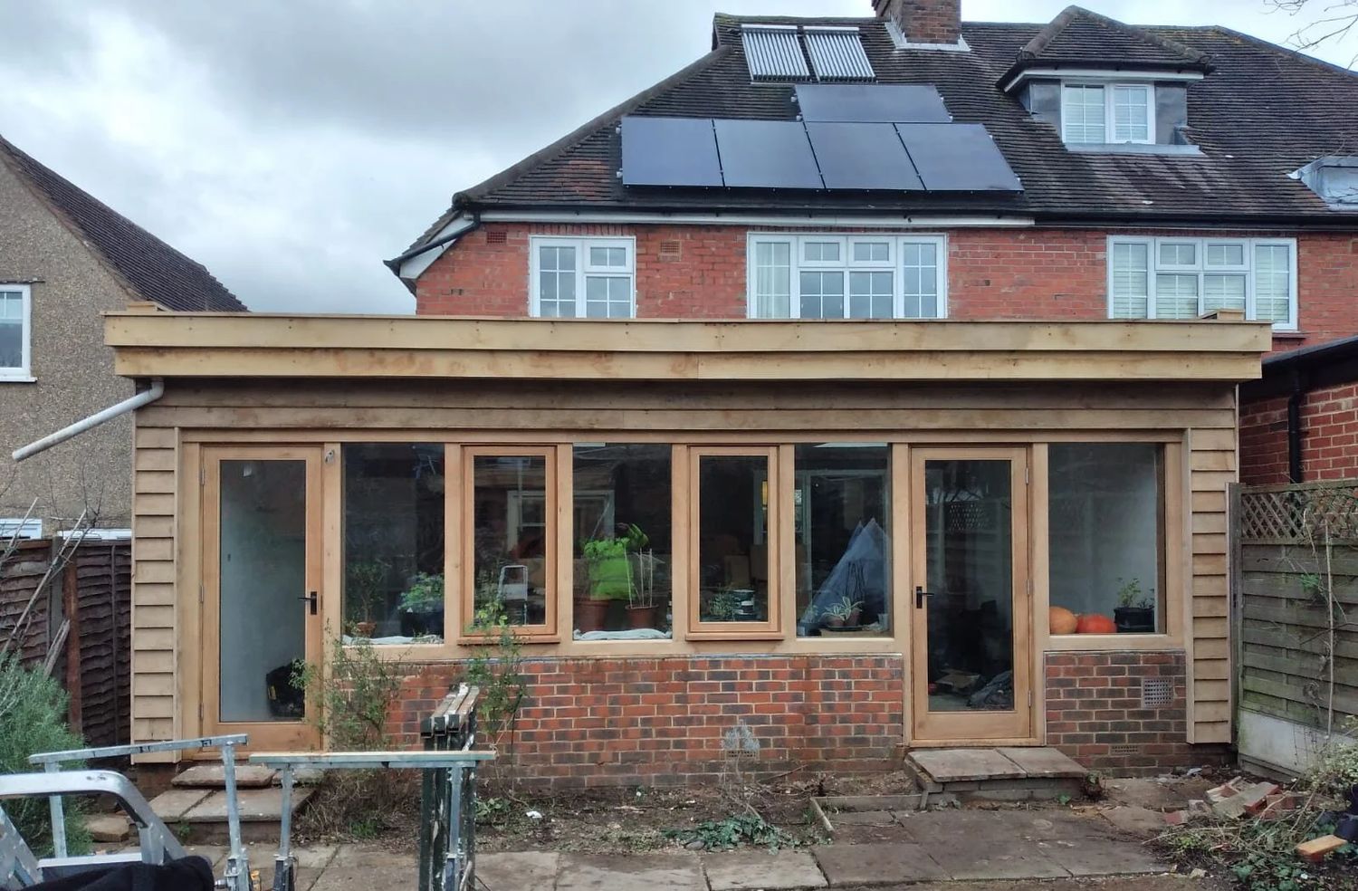 Oak-framed extension with wood fibre insulation and green roof