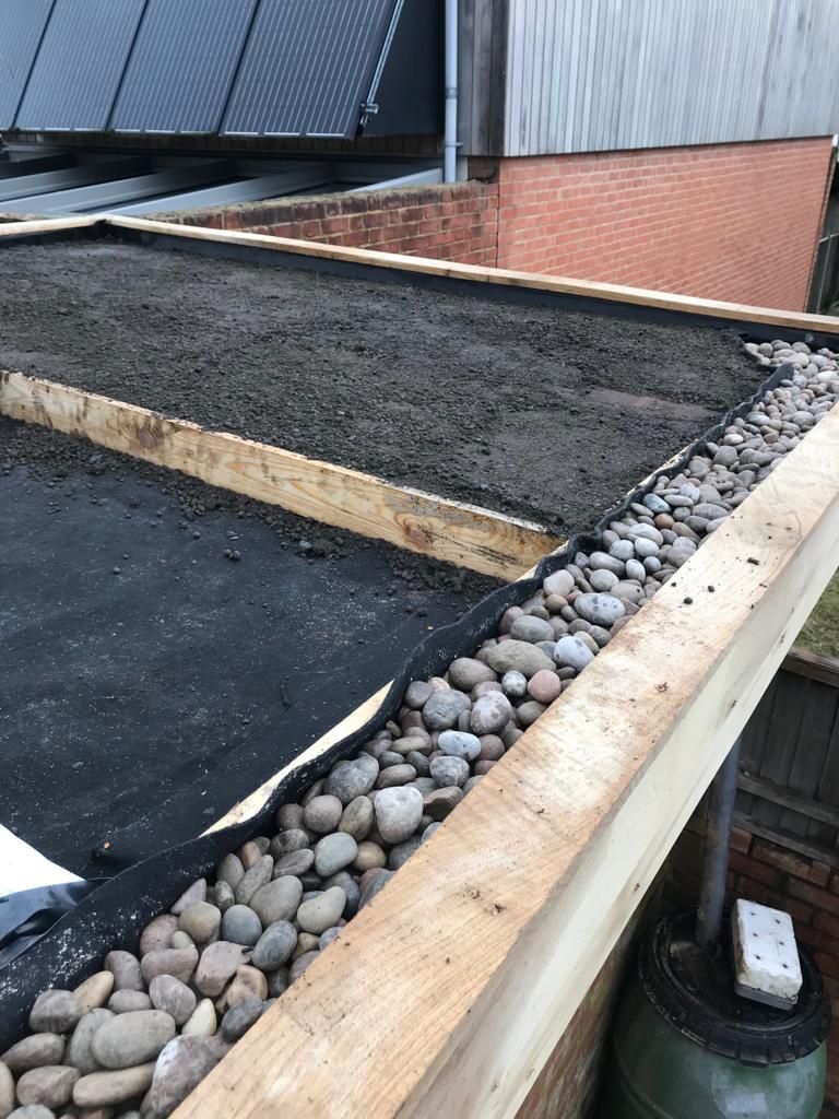 Laying substrate and edging stones onto roof