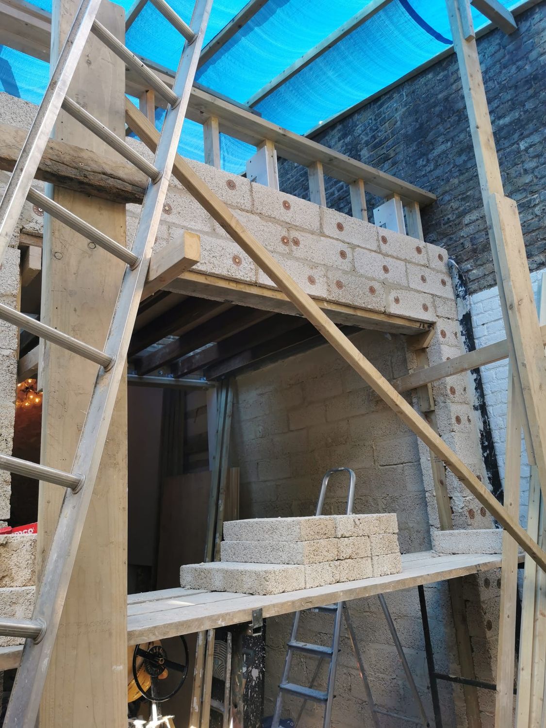 New hempcrete wall with large opening and banister for roof terrace
