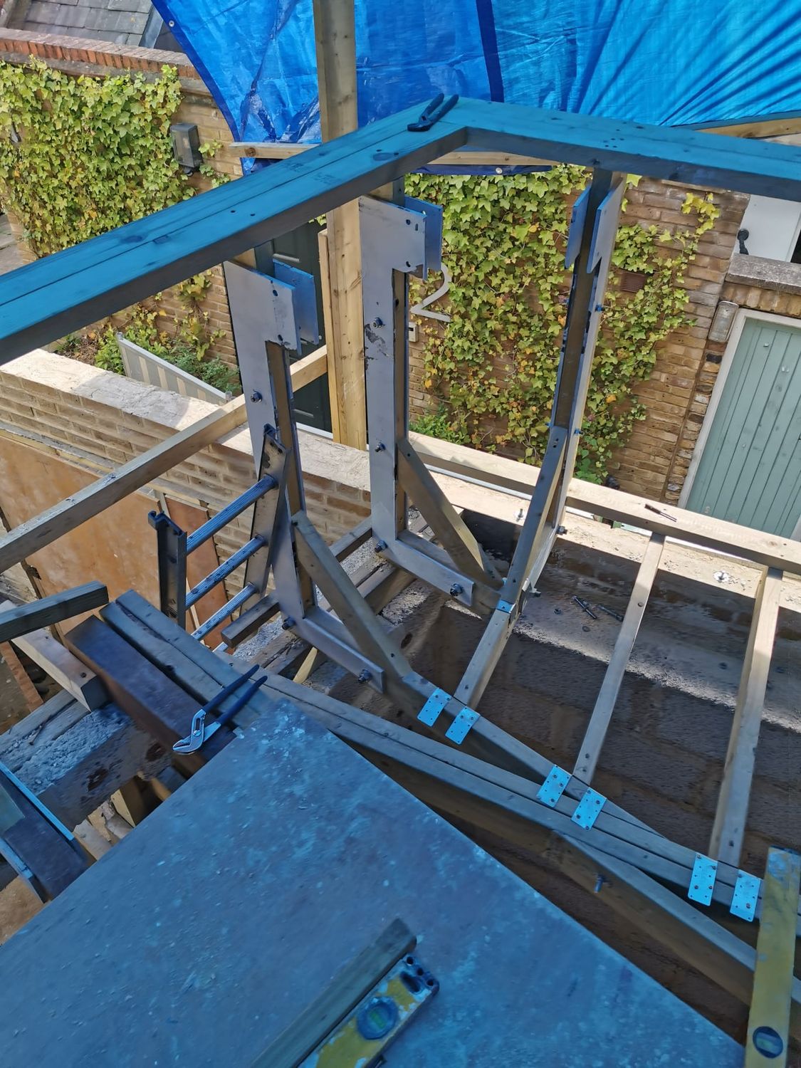 Steel elements inserted to hold banister on the top of extension