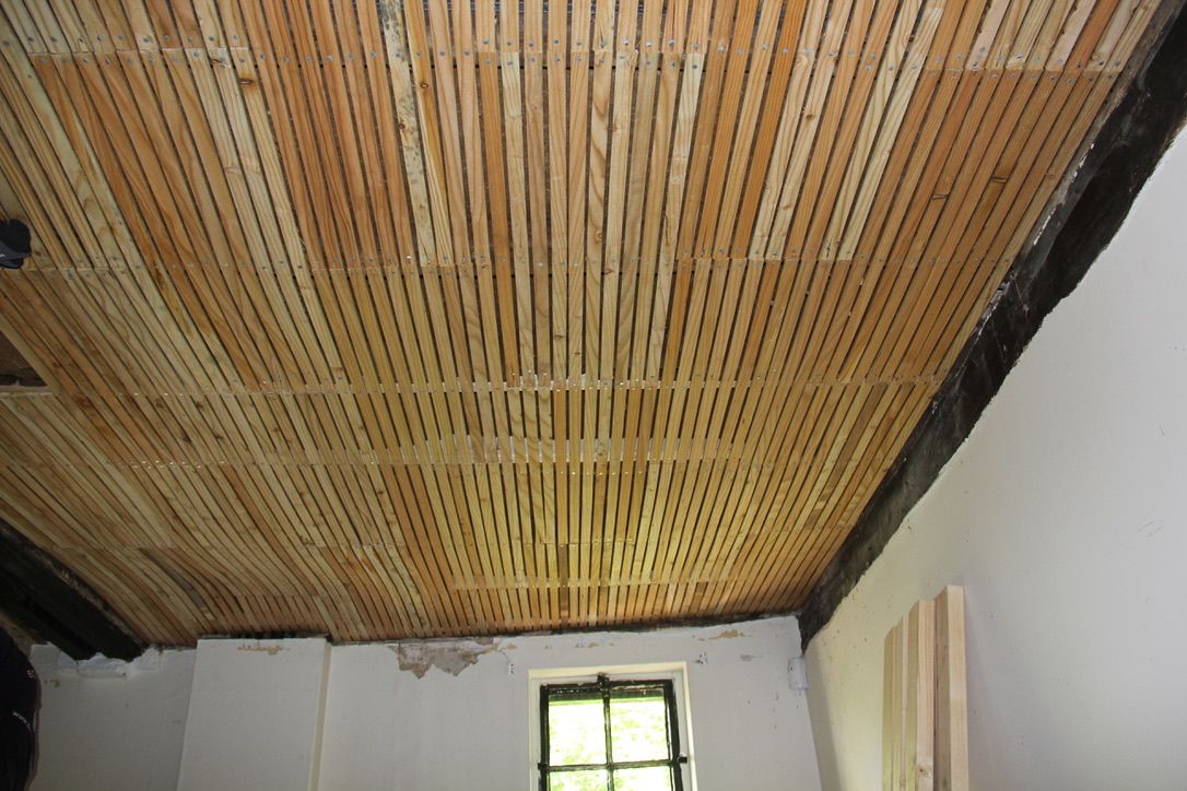 Timber lath nailed to ceiling rafters