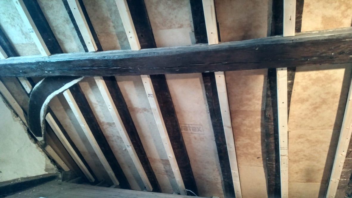 Pavatex waxed wood fibre boards fitted internally between roof rafters